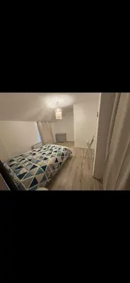 Un ou plusieurs lits dans un hébergement de l'établissement Maison flanc de coteau