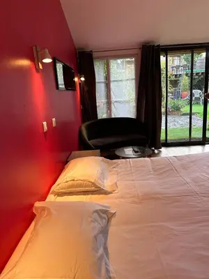 Un ou plusieurs lits dans un hébergement de l'établissement Studio 2 personnes Villandry avec jardin