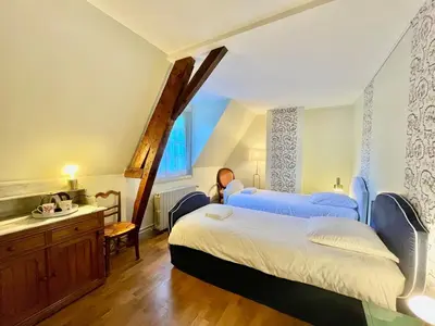 Un ou plusieurs lits dans un hébergement de l'établissement Maison 3 pièces - Dépendance du Château