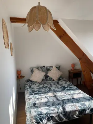 Un ou plusieurs lits dans un hébergement de l'établissement gîte avec sauna