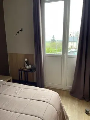 Un ou plusieurs lits dans un hébergement de l'établissement Les Chambres de la Gare