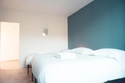 Un ou plusieurs lits dans un hébergement de l'établissement L'Unique- Maison de famille en Plein Centre-Ville