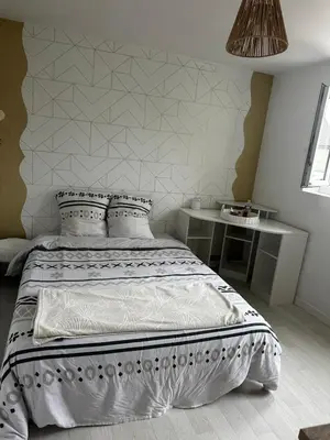Un ou plusieurs lits dans un hébergement de l'établissement Maison Georget