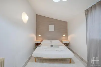 Un ou plusieurs lits dans un hébergement de l'établissement Maison familiale bords de Loire avec jardin et 3 Chambres