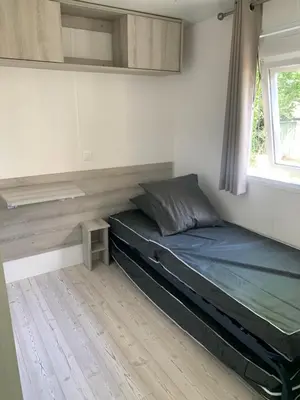 Un ou plusieurs lits dans un hébergement de l'établissement Mobil home près de l étang