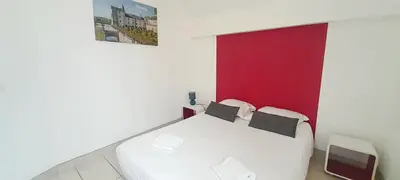 Un ou plusieurs lits dans un hébergement de l'établissement Gîte familial à Azay le Rideau avec Parking