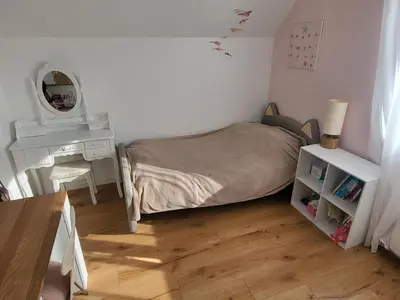 Un ou plusieurs lits dans un hébergement de l'établissement Maison moderne 180 m2, à 10 min du Circuit des 24h du Mans