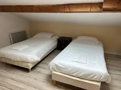 Un ou plusieurs lits dans un hébergement de l'établissement Maison de ville pour groupe, très proche du château de Villandry