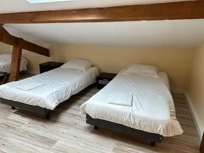 Un ou plusieurs lits dans un hébergement de l'établissement Maison de ville pour groupe, très proche du château de Villandry