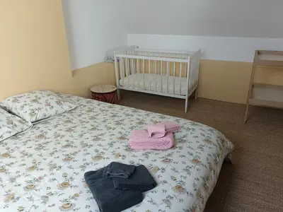 Un ou plusieurs lits dans un hébergement de l'établissement Gîte de l'oeillet