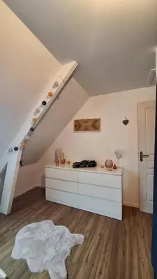 Un ou plusieurs lits dans un hébergement de l'établissement Chambre près du circuit des 24h