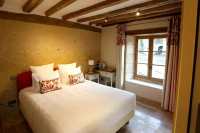Un ou plusieurs lits dans un hébergement de l'établissement Chambre Chinon