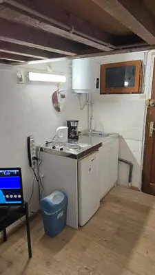 Cuisine ou kitchenette dans l'établissement Studio