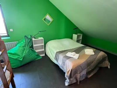 Un ou plusieurs lits dans un hébergement de l'établissement La Villa Camille - vue sur le Thouet BY PRIMO CONCIERGERIE