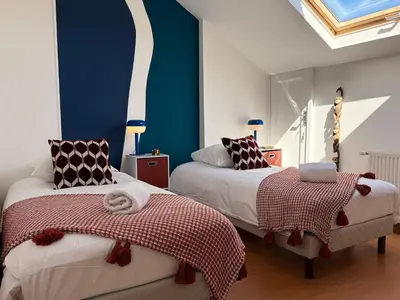 Un ou plusieurs lits dans un hébergement de l'établissement La Solognote-Châteaux & Beauval