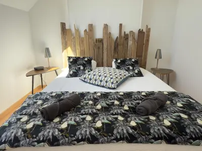 Un ou plusieurs lits dans un hébergement de l'établissement La Solognote-Châteaux & Beauval