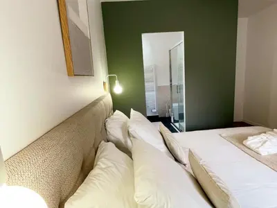 Un ou plusieurs lits dans un hébergement de l'établissement Gîte de luxe avec piscine chauffée et SPA au cœur du Val de Loire - FR-1-381-615