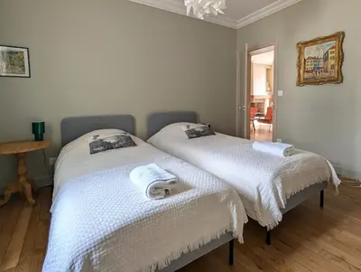 Un ou plusieurs lits dans un hébergement de l'établissement La Maison Royale - Calme en Plein Centre d'Amboise