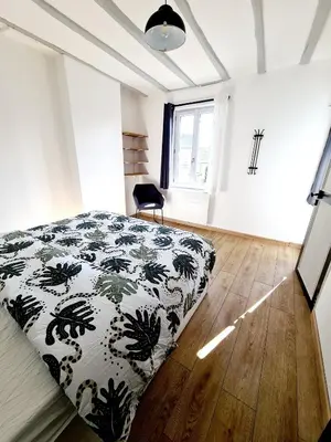 Un ou plusieurs lits dans un hébergement de l'établissement La Petite Maison Tourangelle