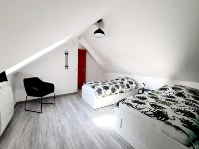 Un ou plusieurs lits dans un hébergement de l'établissement La Petite Maison Tourangelle