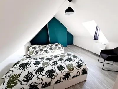 Un ou plusieurs lits dans un hébergement de l'établissement La Petite Maison Tourangelle