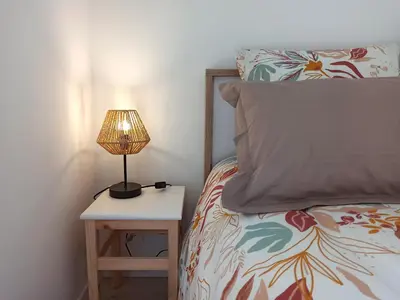 Un ou plusieurs lits dans un hébergement de l'établissement Chambres d'hôtes Le puits du Bréneau