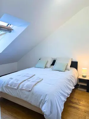 Un ou plusieurs lits dans un hébergement de l'établissement Maison d'exception sur la ligne droite des Hunaudières