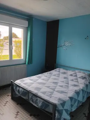 Un ou plusieurs lits dans un hébergement de l'établissement Bienvenue au gite papillon