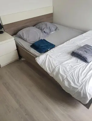 Un ou plusieurs lits dans un hébergement de l'établissement appartement 3 chambre a 10 minute du circuit