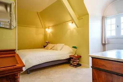 Un ou plusieurs lits dans un hébergement de l'établissement Maison 15 p avec piscine sud Touraine