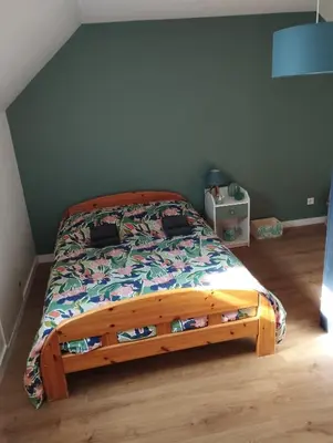 Un ou plusieurs lits dans un hébergement de l'établissement Chambres d'hotes PROCHE CIRCUIT