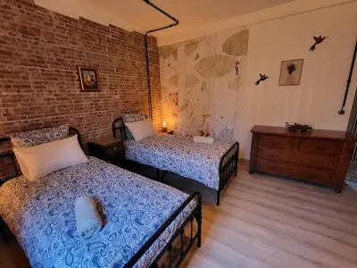 Un ou plusieurs lits dans un hébergement de l'établissement Atelier du chateau