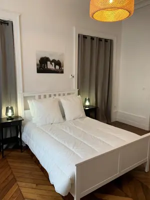 Un ou plusieurs lits dans un hébergement de l'établissement Appartement #2 cœur de ville