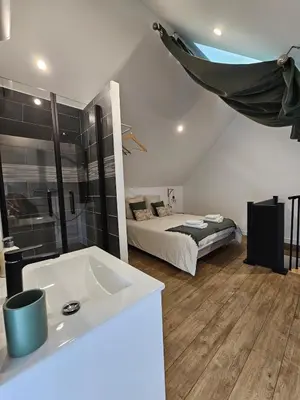 Un ou plusieurs lits dans un hébergement de l'établissement Gite le Magnolia entre Loire et châteaux