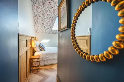 Un ou plusieurs lits dans un hébergement de l'établissement La Maison D'Ambre - Jacuzzi - Sauna- Clim