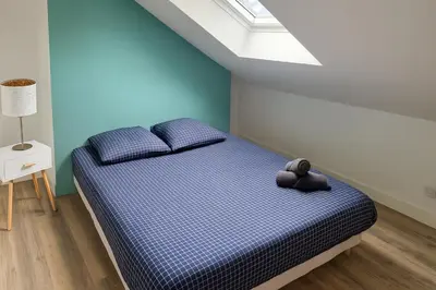 Un ou plusieurs lits dans un hébergement de l'établissement Maison cosy centre-ville 5 chambres