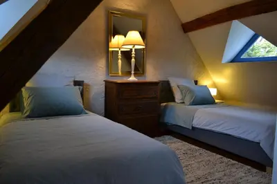 Un ou plusieurs lits dans un hébergement de l'établissement Gîte de charme proche du Zoo Beauval et Châteaux
