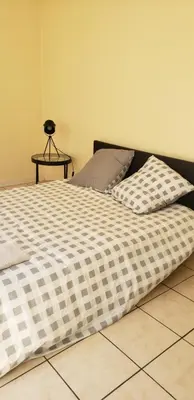 Un ou plusieurs lits dans un hébergement de l'établissement Grand appartement à Thouars