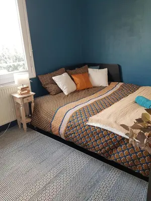 Un ou plusieurs lits dans un hébergement de l'établissement Chambre double chez l'habitant proche du circuit