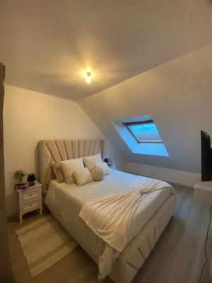Un ou plusieurs lits dans un hébergement de l'établissement Appartement proche de l'entrée des 24h