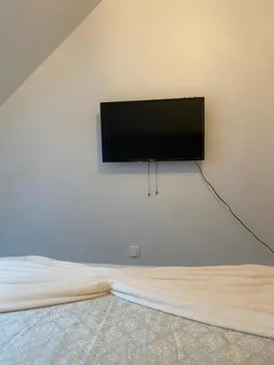 Télévision ou salle de divertissement dans l'établissement Appartement proche de l'entrée des 24h