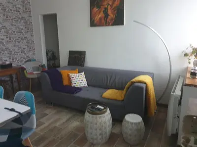 Coin salon dans l'établissement Une petite campagne en ville