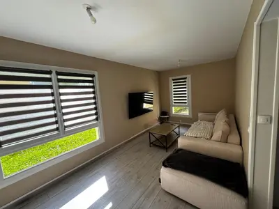 Coin salon dans l'établissement Appartement proche circuit
