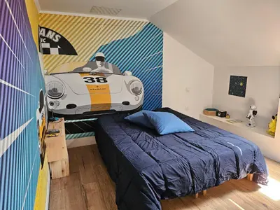 Un ou plusieurs lits dans un hébergement de l'établissement Chambre R proche circuit 24H
