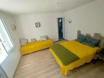 Un ou plusieurs lits dans un hébergement de l'établissement Lodge détente nature Sam'Suffit
