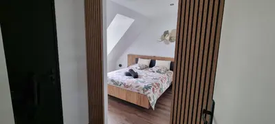 Un ou plusieurs lits dans un hébergement de l'établissement Chambres B&B proche circuit des 24h du Mans
