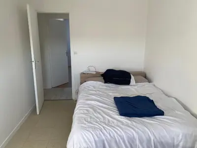 Un ou plusieurs lits dans un hébergement de l'établissement Location 24h Le Mans