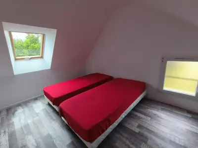 Un ou plusieurs lits dans un hébergement de l'établissement Maisons A