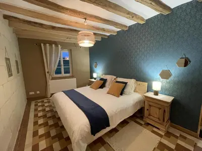 Un ou plusieurs lits dans un hébergement de l'établissement Gîte spacieux en Touraine avec jardin et terrasse, proche vignobles - FR-1-381-605