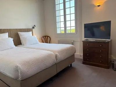 Un ou plusieurs lits dans un hébergement de l'établissement Domaine des Châteaux